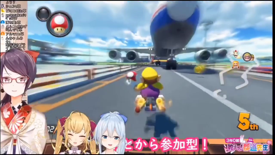 ワリオのカートが巨大な旅客機の車輪の間を通り抜けようとする、ローアングルのマリオカートのゲーム画面。