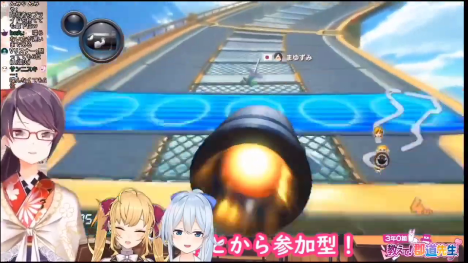 ワリオのカートがコースの壁面を反重力走行するマリオカートのゲーム画面。